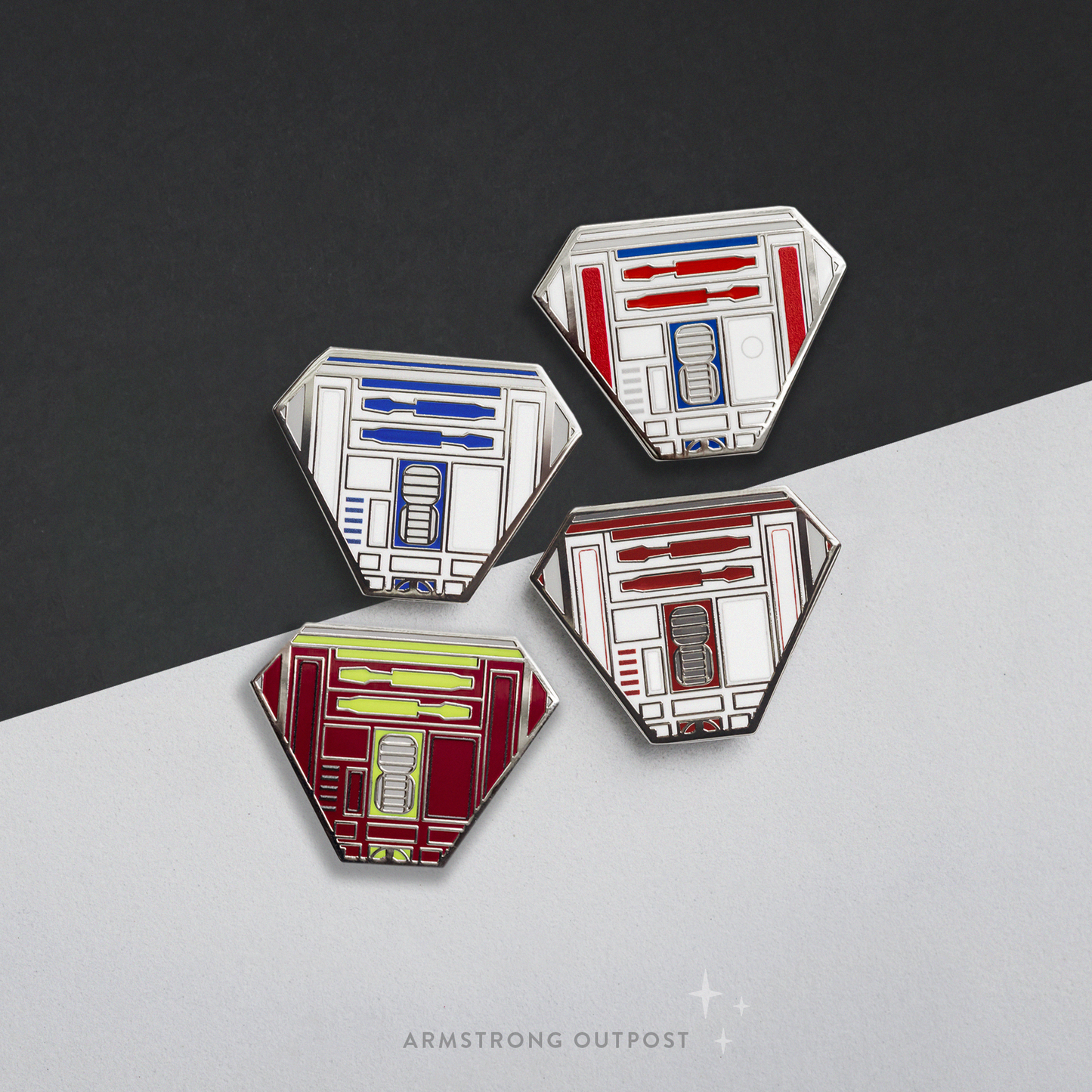 Four geometrically shaped pins with a droid design on a black and white background, featuring the brand 'Armstrong Outpost'.